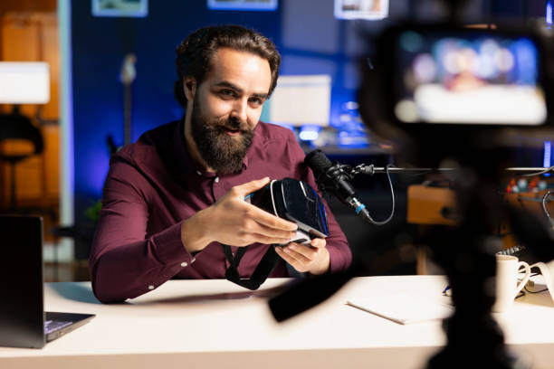 istock Media star showcasing virtual reality headset, filming technology channel vlog 2043204819