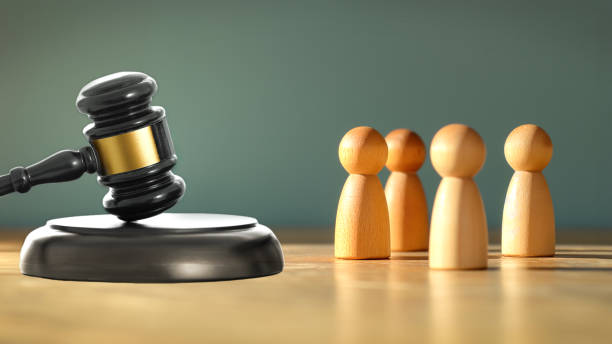 istock Four people in front of the judge gavel 2043209025