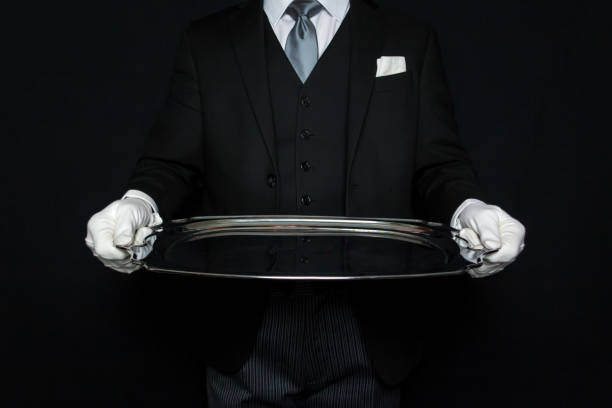 butler holding serving tray - silver platter concierge waiter butler 뉴스 사진 이미지