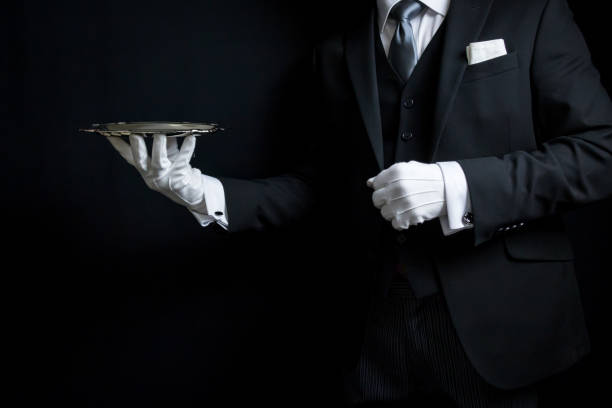 istock Elegant Butler Holding Tray 2043220348