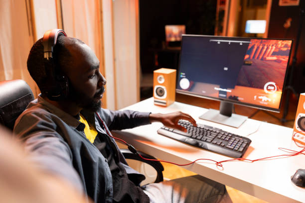 istock Pro gamer wearing headphones playing game, teaching audience 2043221939