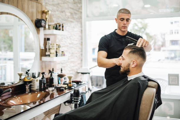 istock Barber shaves the beard of the client 2043224052