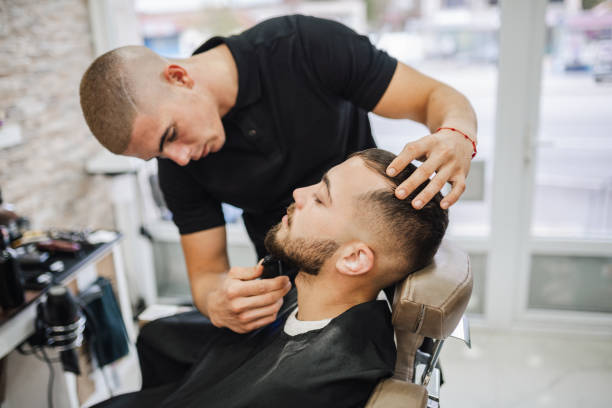 istock Barber shaves the beard of the client 2043224060