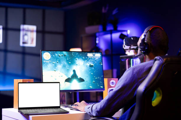 istock Isolated screen laptop next to streamer competing in online videogame 2043229933