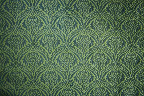 istock The texture of the old tapestry fabric is green with a pattern 2043229978