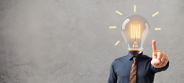 Creative idea or problem solving concept. Light bulb instead of a businessman head.