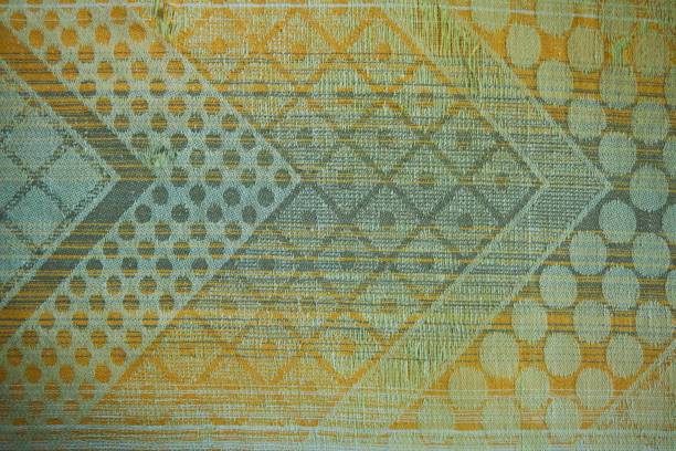 istock The texture of the old tapestry fabric is green with a pattern 2043234235