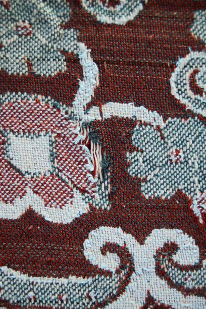 istock The texture of the old tapestry fabric is red with a pattern 2043236917