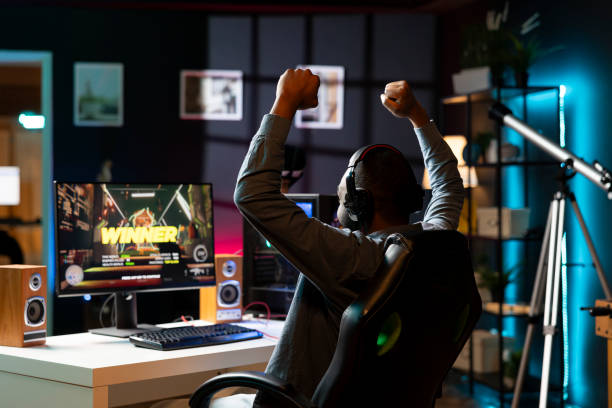 istock Gamer playing with friends online celebrating winning 2043239033