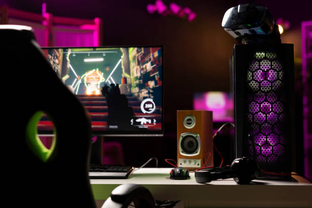 istock FPS videogame left open on desktop pc display and VR glasses in apartment 2043243825