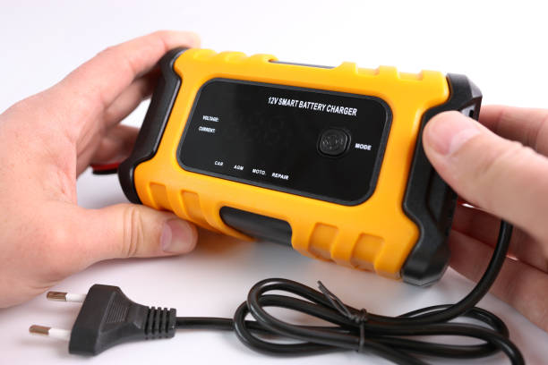 istock A man gets acquainted with the functions and capabilities of a multi-functional charger. 2043250238