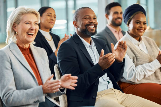 istock Business people, diversity and applause as audience for presentation at training workshop, conference or coaching. Colleagues, clapping and corporate meeting in London for proposal, support or event 2043254520