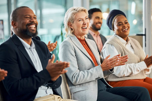 istock Business people, diversity and applause for presentation at training workshop or welcome, conference or coaching. Colleagues, clapping and corporate meeting in London for proposal, support or event 2043254915