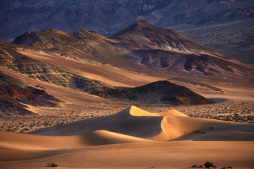 A Sunset light illuminating dunes in the desert