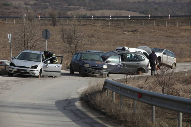 Fire and rescue units work at a car crash on the A1 highway junction near the town of Ihtiman, Bulgaria. Ihtiman, Bulgaria - February 15, 2024: Fire and rescue units work at a car crash on the A1 highway junction near the town of Ihtiman, Bulgaria. Car accident stock pictures, royalty-free photos & images