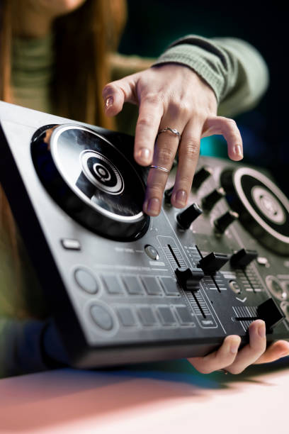 istock DJ showing high tech musical gear to interested fans 2043290426