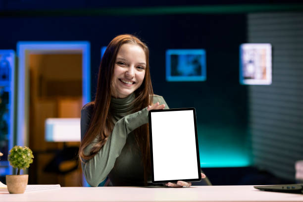 istock Happy gen Z influencer analyzing latest generation of isolated screen tablet 2043306681