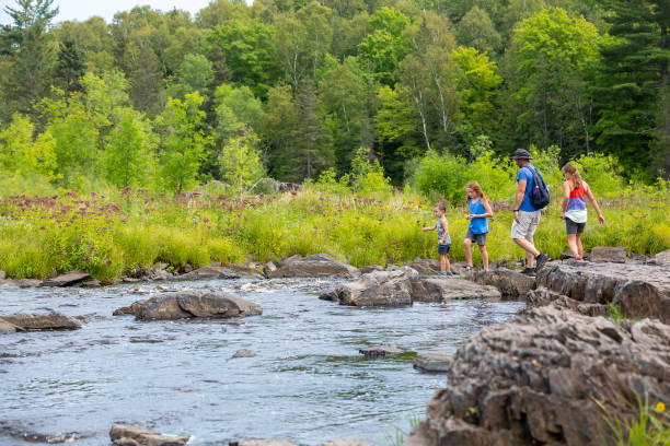 istock Family Exploring St. Louis Riverbank 2043313509