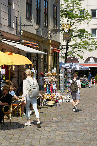 Berlin, Germany – May 28, 2023: Tourists at a souvenir store in the popular Nikolai quarter in the center of Berlin