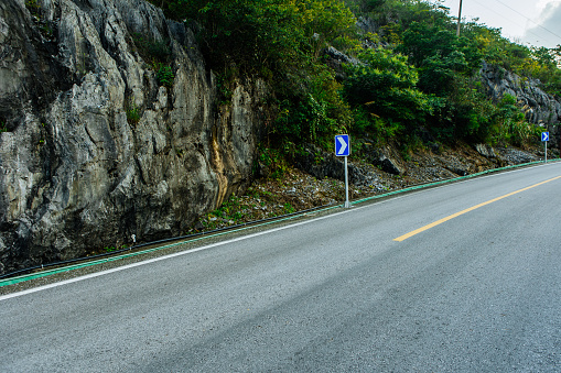Background image of car advertisements on mountain roads