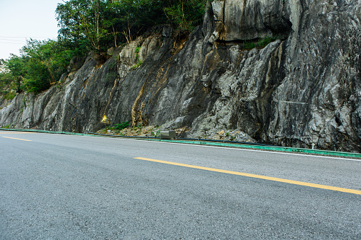 Background image of car advertisements on mountain roads