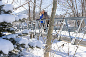 Mature couple on bridge in winter