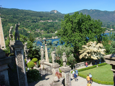 Beautiful view of the garden, sculpture and lake on a summer day. Isola Bella. Italy.