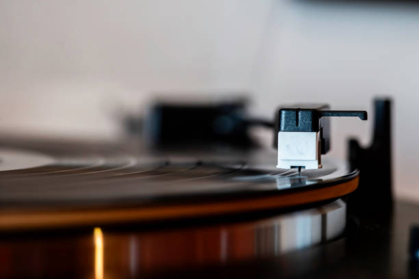 istock a record player with a black and white plastic building block figure attached to it's cover 2043357669