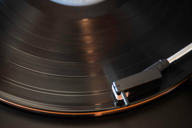 A close-up view of a vinyl player turntable with a white circle