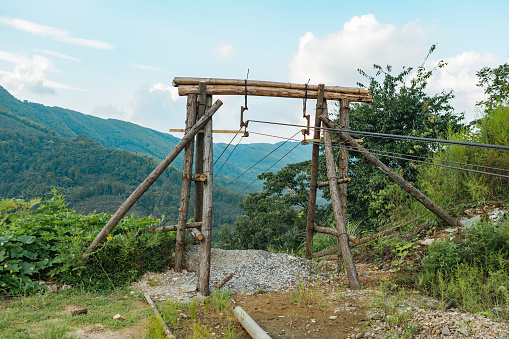 Transport goods by air, between mountains