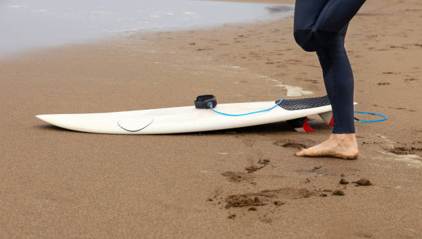 istock Cutout of a surfer's legs with a surfboard, copy space. 2043385106