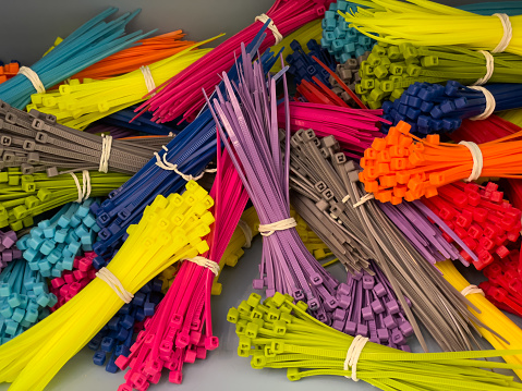 Bunches of multi-colored zip ties held together with rubber bands