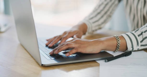 istock Laptop, hands or woman typing digital search on website homepage, internet or web for work from home research. Report, social media or person scroll on webpage dashboard for ecommerce online shopping 2043430699