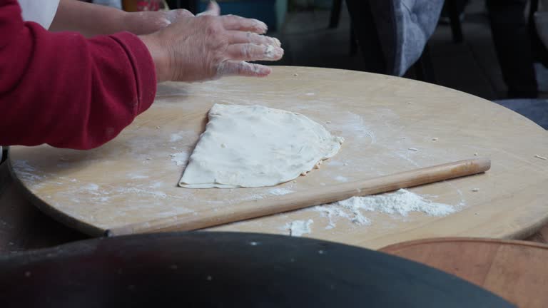 making layered pastry with cheese filling