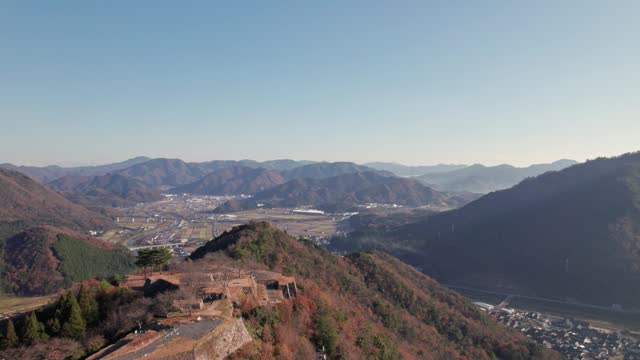 Top Green Mountain Peak of Ancient Takeda Castle Ruins Japanese Skyline Drone Aerial View above Ancient Fortress