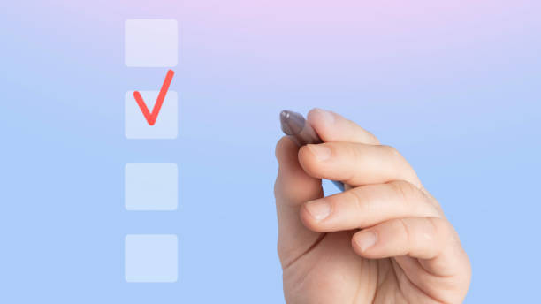 istock Hand with pen and checkbox, choice concept. Checklist concept. Businessman using laptop and checking mark on checkboxes on virtual screen. Checking mark up on check boxes 2043465043