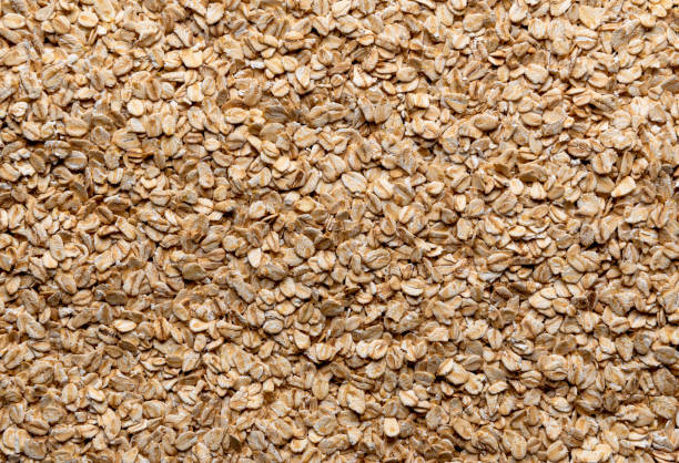 istock Oat cereals pile above view, full frame background 2043510939