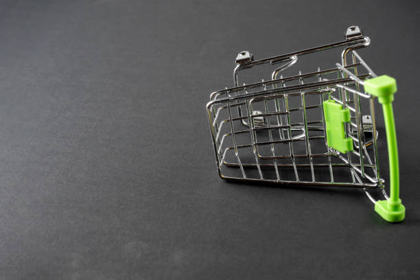 istock The grocery basket is empty on a black background. Side view, Copy space 2043514629