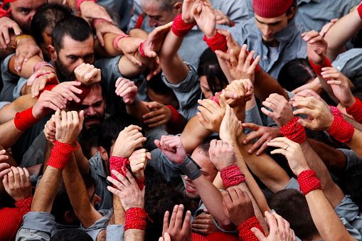 “Castells” are human towers, built with a technique that requires great coordination and skill. The people who form part of the castle are called 