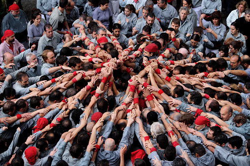 “Castells” are human towers, built with a technique that requires great coordination and skill. The people who form part of the castle are called 