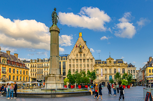 Lille, France, July 3, 2023: La Grand Place square General de Gaulle in historical center, Vieille Bourse, Column of Goddess, La Voix du Nord, Theatre du Nord, French Flanders, Hauts-de-France Region