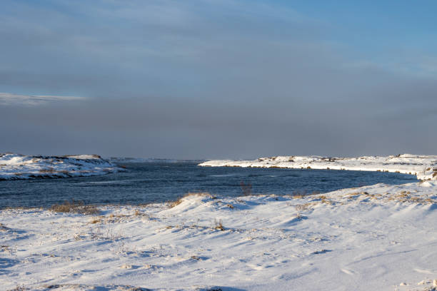 istock River and a country with snow, Iceland 2043566624