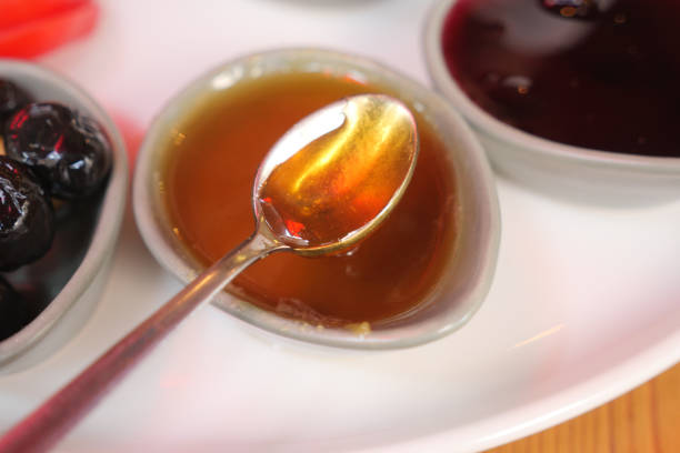 close up of spoon pick fresh honey.