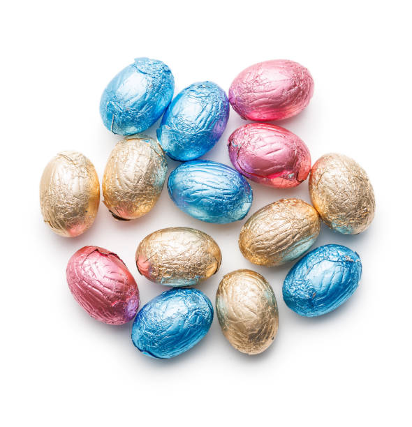 istock Easter chocolate eggs wrapped in aluminium foil isolated on white background. 2043629328