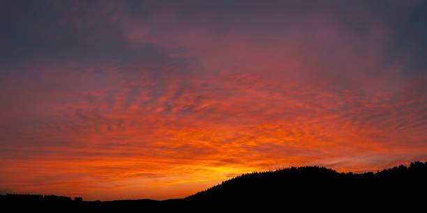 istock Silhouette of landscape on dramatic dusk sky with clouds. 2043688775