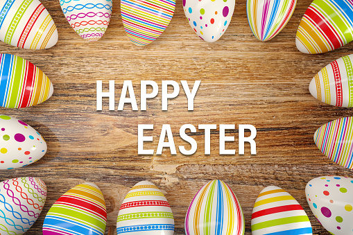 3d render of sixteen colorful painted Easter eggs on rustic dark wood table and text Happy Easter