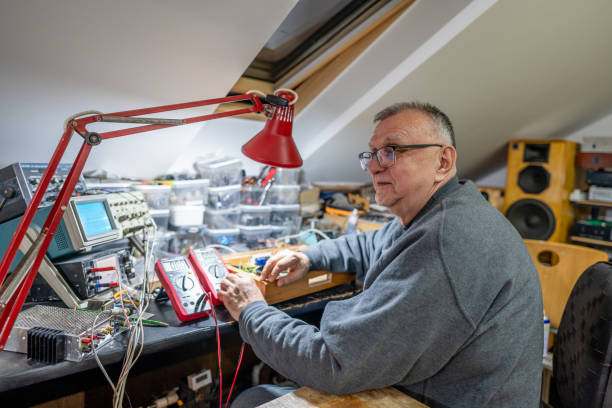 istock Senior man using a soldering iron medtronic at home 2043715312
