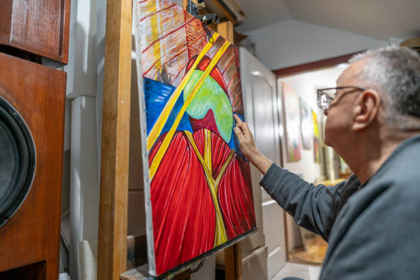 istock Senior artist painting on his canvas 2043718542