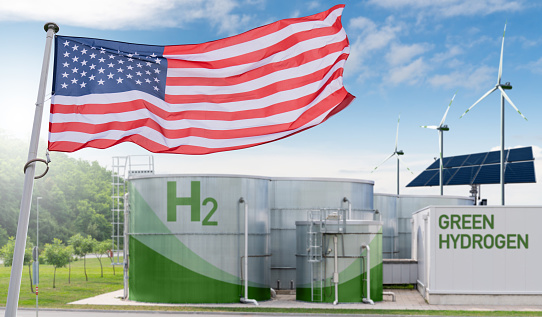 American flag on a background of green hydrogen factory. Concept