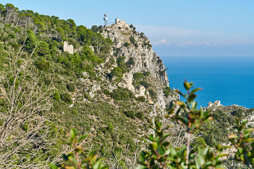 Wild landscape along the Ligurian coastline between Noli and Finale Ligure. In the background the old telegraph tower station known as \
